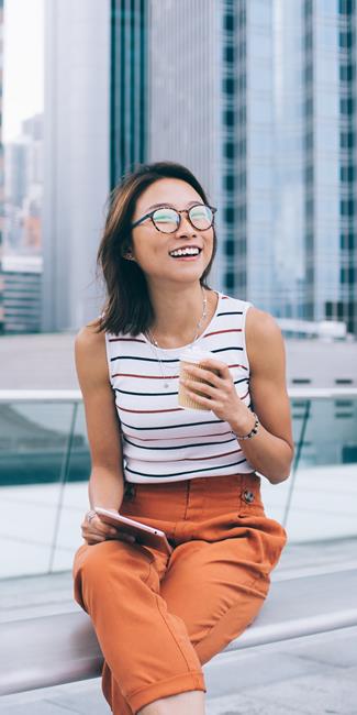 Happy Young Woman Sitting With A Cup Of Coffee Original File